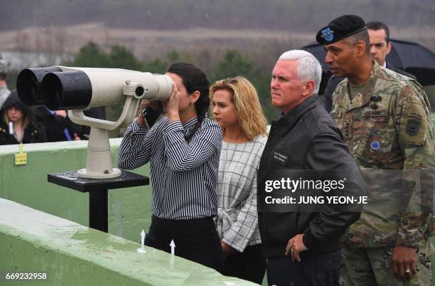 Vice President Mike Pence visits Observation Post Ouellette with his daughters near the truce village of Panmunjom in the Demilitarized Zone on the...