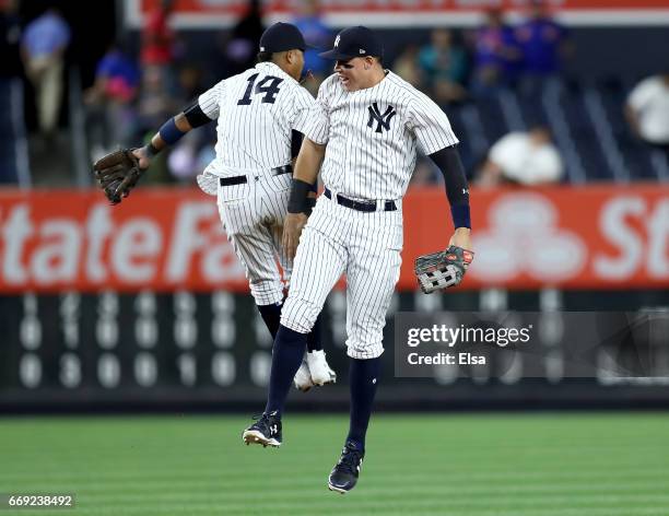 Starlin Castro and Aaron Judge of the New York Yankees celebrate the 9-3 win over the St. Louis Cardinals on April 16, 2017 at Yankee Stadium in the...