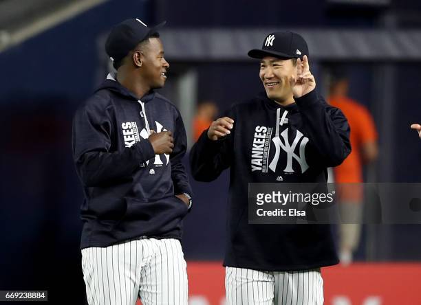 Luis Severino and Masahiro Tanaka of the New York Yankees walk in from the bullpen before the game against the St. Louis Cardinals on April 16, 2017...