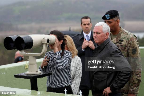 Vice President Mike Pence, center right, and his daughter Audrey, left, look across to the north side of the border from the Observation Post...