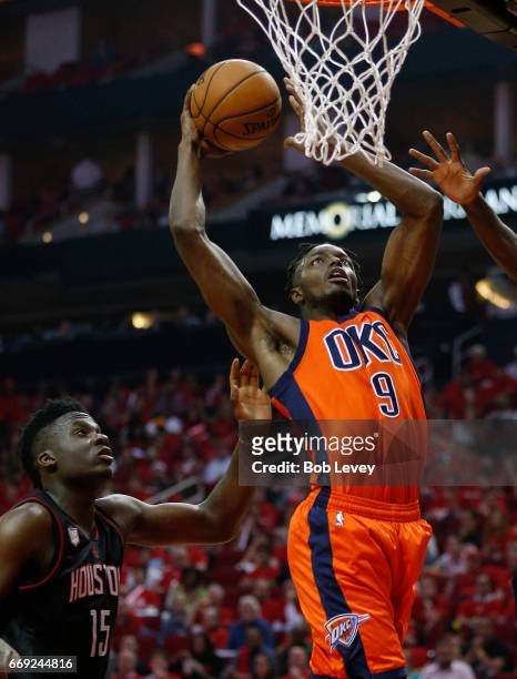 Jerami Grant of the Oklahoma City Thunder dunks on Clint Capela of the Houston Rockets during Game One of the first round of the Western Conference...