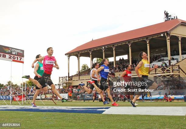 Matthew Rizzo celebrates as he crosses the finish line to win the 2017 Stawell Athletic Club Stawell Gift - 120m Final race during the 2017 Stawell...