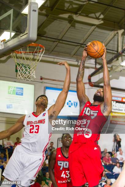 Jordan Mickey of the Maine Red Claws stretches for a rebound grabbed by C. J. Leslie of the Raptors 905 in Game 1 of the NBADL Eastern Conference...