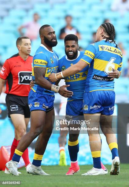 Michael Jennings of the Eels celebrates scoring a try with team mates during the round seven NRL match between the Parramatta Eels and the Wests...