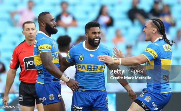 Michael Jennings of the Eels celebrates scoring a try with team mates during the round seven NRL match between the Parramatta Eels and the Wests...