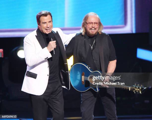 Barry Gibb of the Bee Gees and actor John Travolta onstage during the Stayin' Alive: A GRAMMY Salute To The Music Of The Bee Gees held at Microsoft...