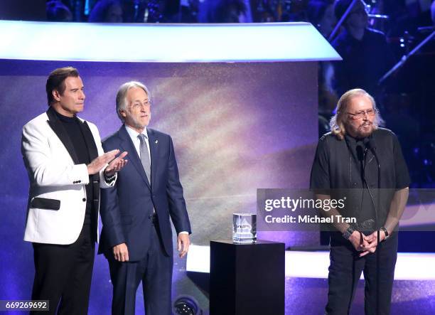 Barry Gibb of the Bee Gees with actor John Travolta an Neil Portnow onstage during the Stayin' Alive: A GRAMMY Salute To The Music Of The Bee Gees...