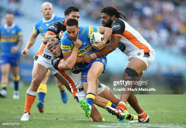 Corey Norman of the Eels is tackled during the round seven NRL match between the Parramatta Eels and the Wests Tigers at ANZ Stadium on April 17,...