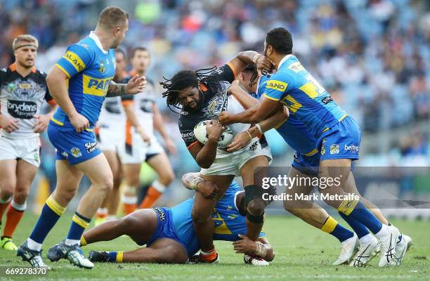 Jamal Idris of the Tigers is tackled during the round seven NRL match between the Parramatta Eels and the Wests Tigers at ANZ Stadium on April 17,...