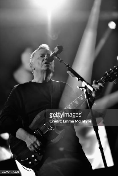 Musician Bernard Sumner of New Order performs on the Mojave stage during day 3 of the Coachella Valley Music And Arts Festival at the Empire Polo...