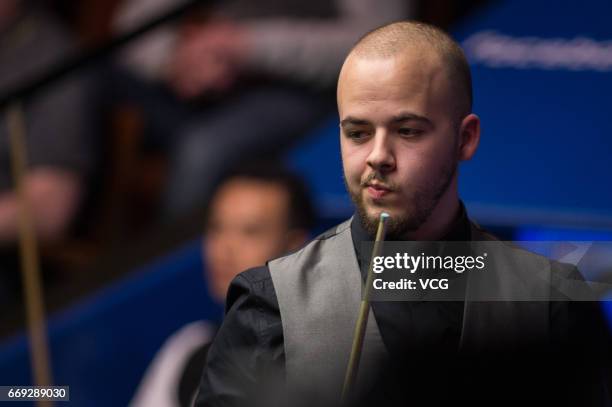 Luca Brecel of Belgium reacts during his first round match against Marco Fu of Hong Kong on day two of Betfred World Championship 2017 at Crucible...