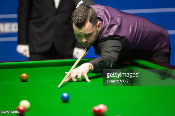 Jimmy Robertson of England plays a shot during his first round match against Mark Allen of Northern Ireland on day two of Betfred World Championship...