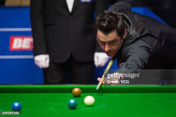 Ronnie O'Sullivan of England plays a shot during his first round match against Gary Wilson of England on day two of Betfred World Championship 2017...