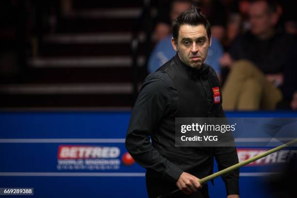 Ronnie O'Sullivan of England reacts during his first round match against Gary Wilson of England on day two of Betfred World Championship 2017 at...