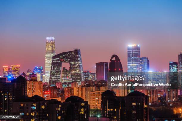 high angle view of beijing skyline at dusk - cctv headquarters stock pictures, royalty-free photos & images