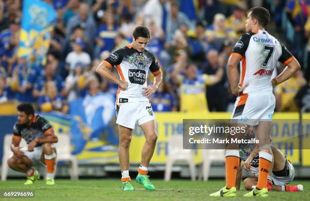 Mitch Moses of the Tigers looks dejected after defeat in the round seven NRL match between the Parramatta Eels and the Wests Tigers at ANZ Stadium on...