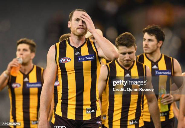 Jarryd Roughead of the Hawks looks dejected as he leads his team off the field after losing the round four AFL match between the Hawthorn Hawks and...