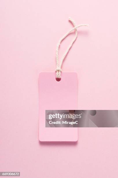 pink label on pink colored background - blank card stock pictures, royalty-free photos & images