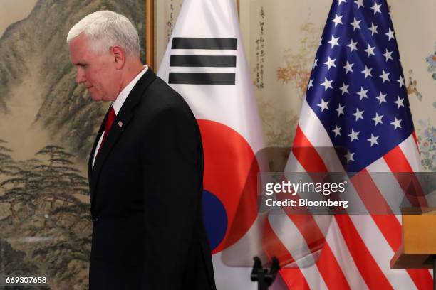Vice President Mike Pence attends a joint news conference with Hwang Kyo-ahn, South Korea's acting president and prime minister, not pictured, after...