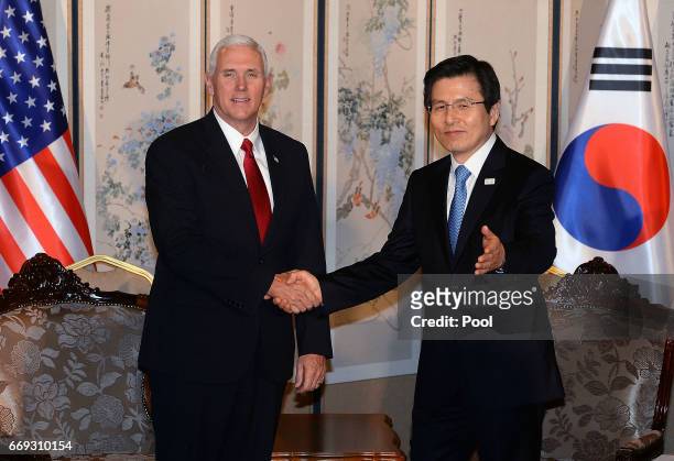 Vice President Mike Pence shakes hands with South Korean acting president and prime minister Hwang Kyo-ahn during their meeting on April 17, 2017 in...