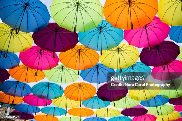 colorful umbrellas - multi coloured umbrella stock pictures, royalty-free photos & images