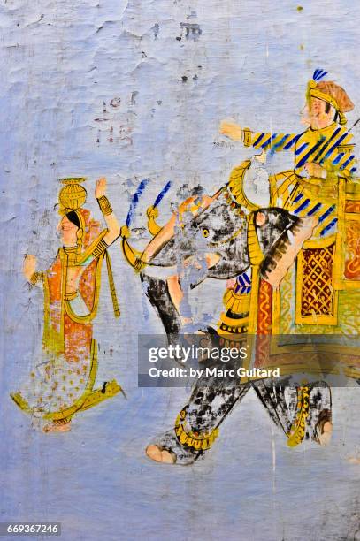 an old painting of a cultural scene on a wall inside udaipur city palace, udaipur, rajasthan, india - medieval stock illustrations stock illustrations