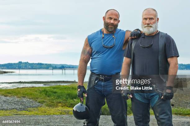 two bikers horizontal crop - leather pants stock pictures, royalty-free photos & images