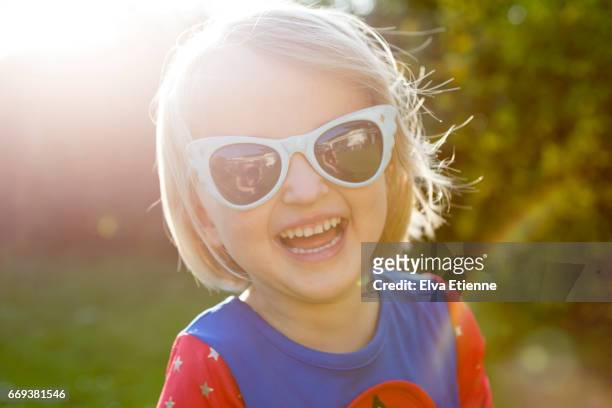 laughing, happy child in retro sunglasses - face happy sun stockfoto's en -beelden