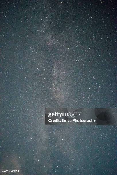 milky way and falling stars - composizione verticale stock pictures, royalty-free photos & images
