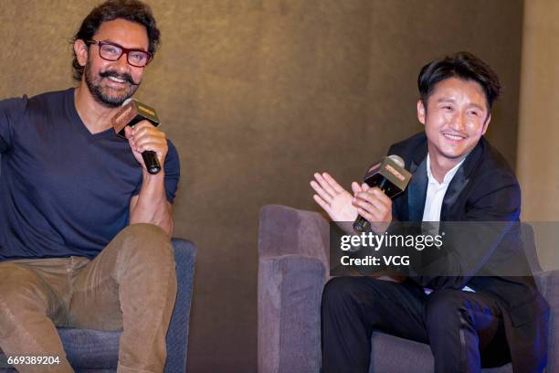 Indian actor and producer Aamir Khan and Chinese boxer Zou Shiming attend the press conference of Bollywood director Nitesh Tiwari's film 'Dangal'...