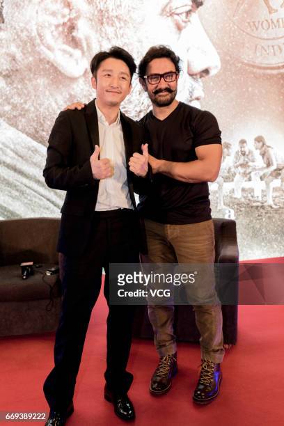 Indian actor and producer Aamir Khan and Chinese boxer Zou Shiming attend the press conference of Bollywood director Nitesh Tiwari's film 'Dangal'...