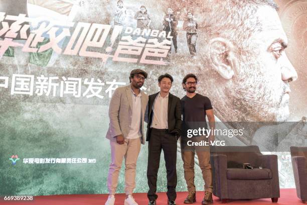 Indian actor and producer Aamir Khan and Chinese boxer Zou Shiming attend the press conference of Bollywood director Nitesh Tiwari's film 'Dangal'...