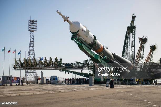 In this handout provided by NASA, The Soyuz MS-04 spacecraft is raised into position on the launch pad Monday, April 17, 2017 at the Baikonur...