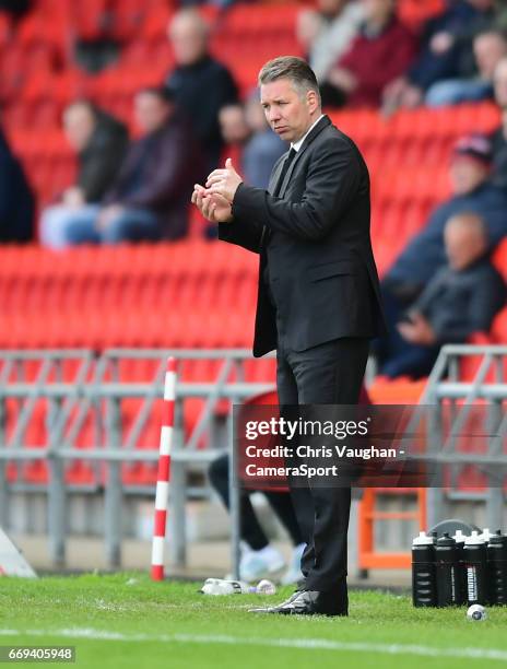 Doncaster Rovers manager Darren Ferguson shouts instructions to his team from the dug-out during the Sky Bet League Two match between Doncaster...