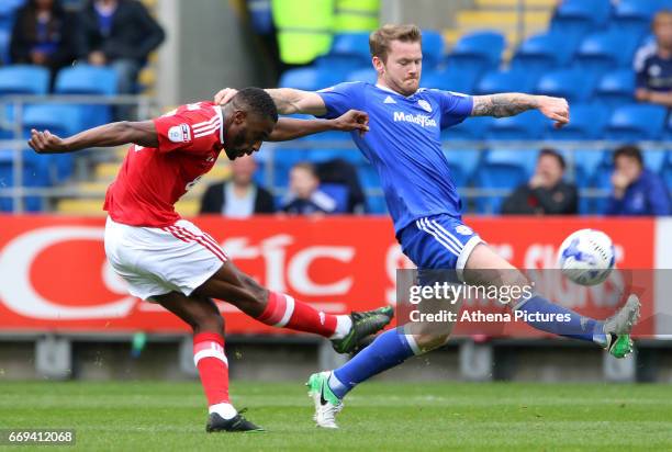 Mustapha Carayol of Nottingham Forest has a shot on goal whilst under pressure from Aron Gunnarsson of Cardiff City during the Sky Bet Championship...