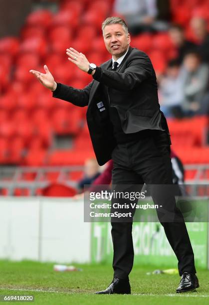 Doncaster Rovers manager Darren Ferguson shouts instructions to his team from the dug-out during the Sky Bet League Two match between Doncaster...