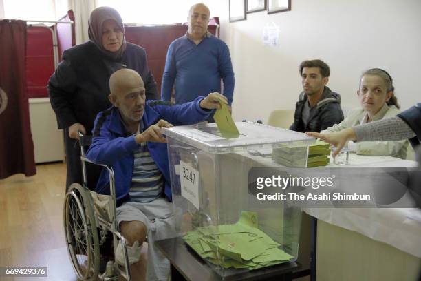 Turkish people vote for the referendum at a polling station on April 16, 2017 in Istanbul, Turkey. Millions of Turks are heading to the polls to vote...