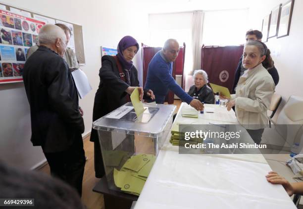 Turkish people vote for the referendum at a polling station on April 16, 2017 in Istanbul, Turkey. Millions of Turks are heading to the polls to vote...