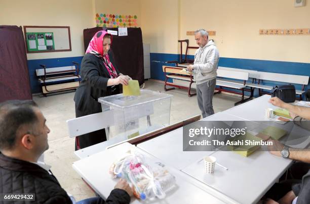 Turkish people vote for the referendum at a polling station on April 16, 2017 in Istanbul, Turkey. Millions of Turks are heading to the polls to vote...