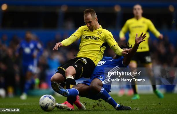 Luke Varney of Burton Albion is tackled by Jacques Maghoma of Birmingham City during the Sky Bet Championship match between Birmingham City and...