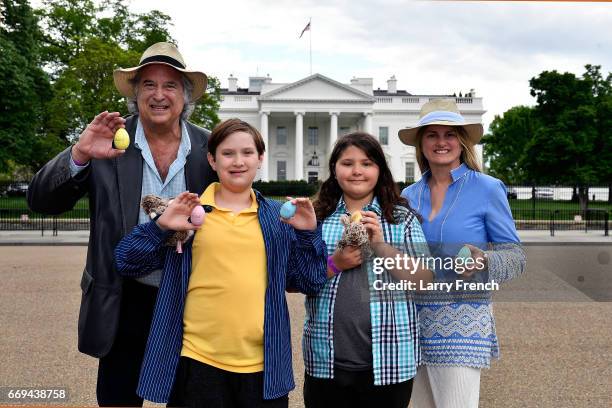 Producer Stewart F. Lane, Frankie Lane, Lenny Lane, and producer Bonnie Comley hold Official Commemorative White House Easter eggs after attending...