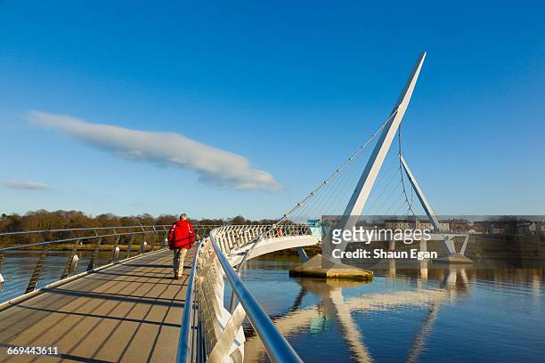 peace bridge, londonderry, northern ireland - river foyle stock pictures, royalty-free photos & images