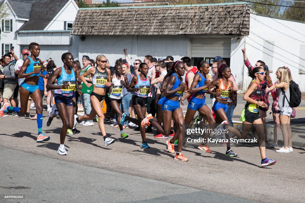 Crowds Gather Along Route Of Boston Marathon To Cheer On Runners