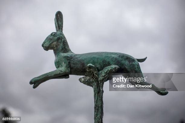 The Warrener holds his Bronze hare-topped staff before a church service at St Michael's Church on April 17, 2017 in Hallaton, England. Hallaton hosts...