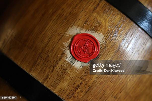 One of the bottles is sealed with a wax emblem in the shape of a hare ahead of the Hare Pie Scramble, and Bottle Kicking event on April 17, 2017 in...