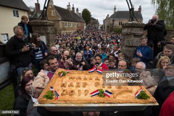 The hare pie is blessed by the vicar after being carried through the village on April 17, 2017 in Hallaton, England. Hallaton hosts the Hare Pie...