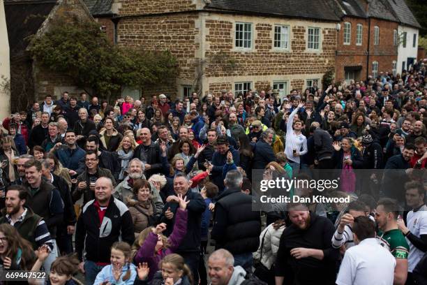 The hare pie is thrown to the crowd after being carried through the village on April 17, 2017 in Hallaton, England. Hallaton hosts the Hare Pie...