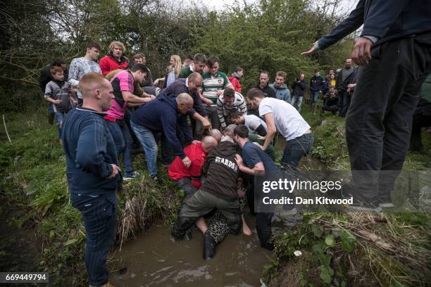 The first round of the bottle Kicking gets underway over the Hare Pie Hill on April 17, 2017 in Hallaton, England. Hallaton hosts the Hare Pie...