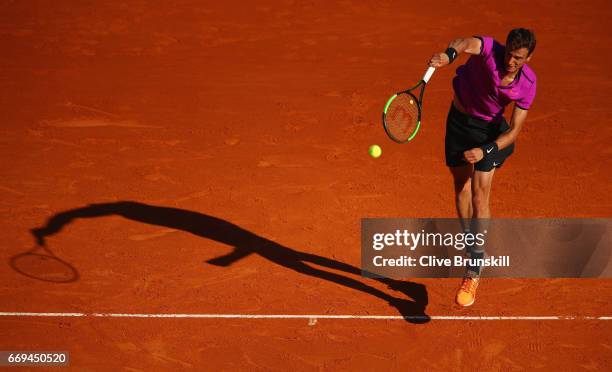 Andrey Kuznetsov of Russia serves against Tomas Berdych of the Czech Republic in their first round match on day two of the Monte Carlo Rolex Masters...