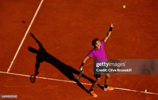 Andrey Kuznetsov of Russia serves against Tomas Berdych of the Czech Republic in their first round match on day two of the Monte Carlo Rolex Masters...